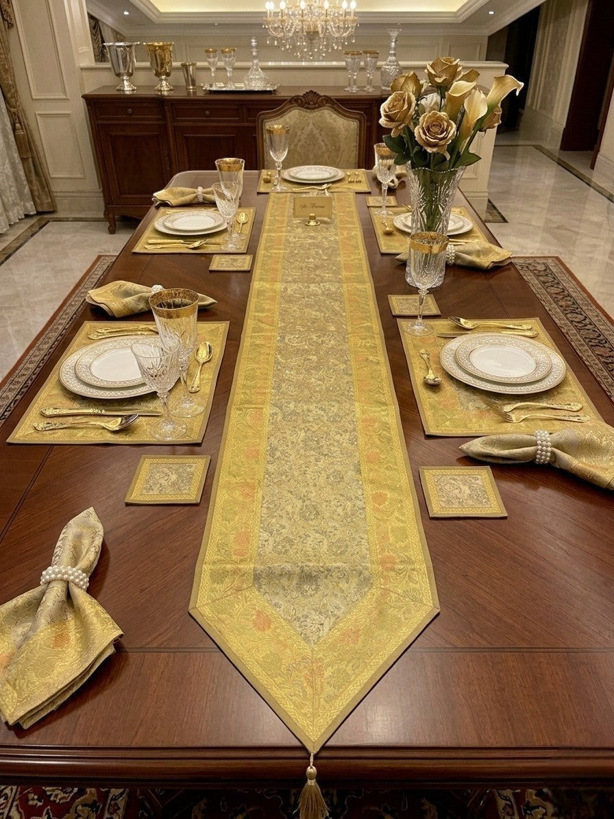 Noori Couture 13-piece Royal Zari dining set with gold paisley Tanchoi weaving, zari borders, and tassels on silk fabric.