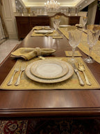 Noori Couture 13-piece Royal Zari dining set with gold paisley Tanchoi weaving, floral zari borders, and tassels on silk fabric.