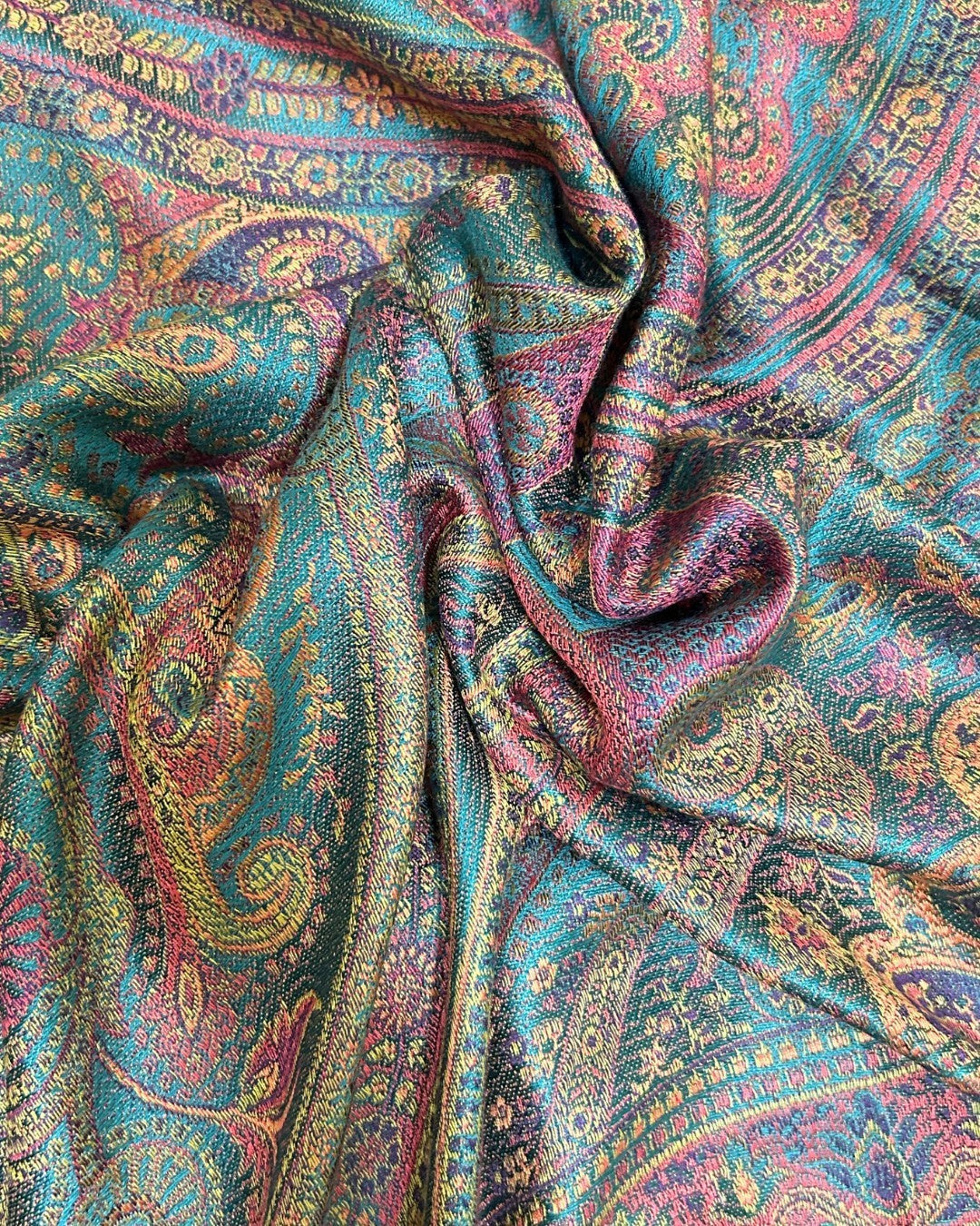 Noori Couture handwoven pure silk shawl in teal with paisley pattern in pink, gold, and purple. Luxurious and soft.
