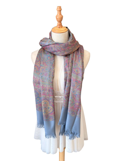 Noori Couture slate grey handwoven pashmina shawl featuring intricate multi-colored paisley patterns and fringed edges.