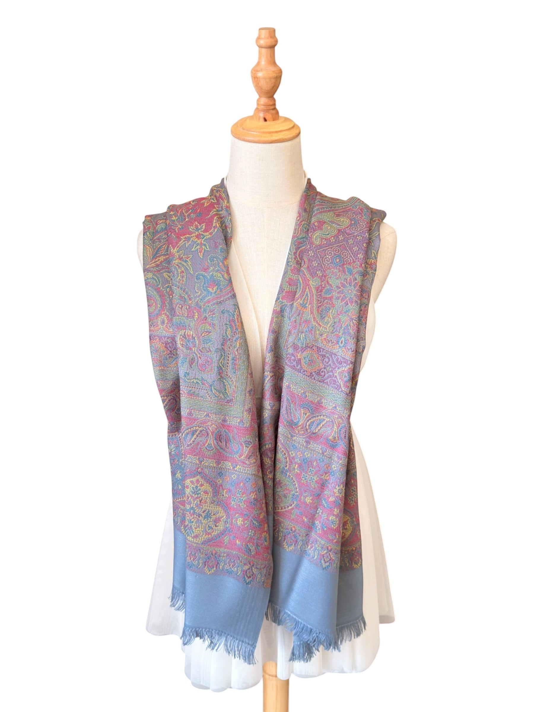 Noori Couture slate grey handwoven pashmina shawl featuring intricate multi-colored paisley patterns and fringe edges.