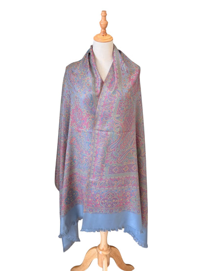 Noori Couture slate grey handwoven pashmina shawl featuring intricate multi-colored paisley patterns and fringed edges.