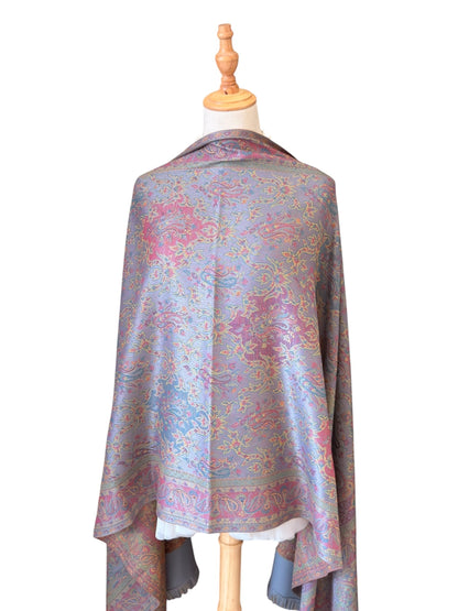 Noori Couture slate grey handwoven pashmina shawl featuring intricate multi-colored paisley patterns and fringe edges.