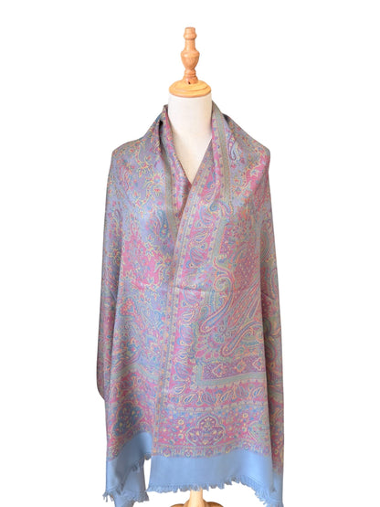 Noori Couture slate grey handwoven pashmina shawl featuring intricate multi-colored paisley patterns and fringe edges.