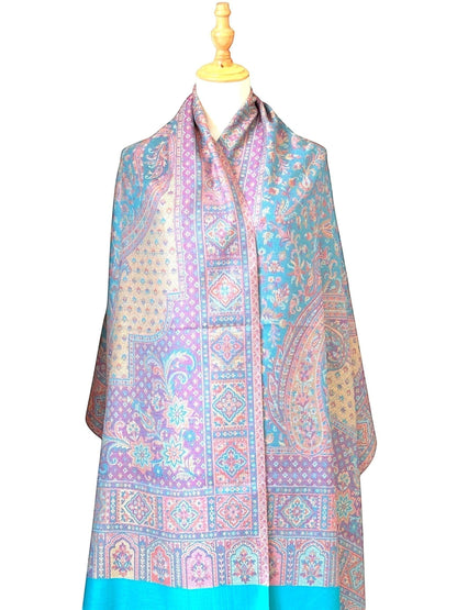 Noori Couture pashmina shawl featuring intricate teal, violet, and gold paisley and geometric patterns with fringe hem.