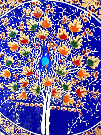 Noori Couture handpainted papier-mâché coaster set with Tree of Life motif, blue, orange, green, and gold.