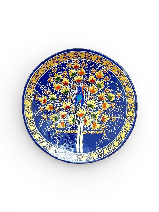 Noori Couture handpainted papier-mâché decorative plate with Tree of Life motif, deep blue with gold accents.