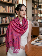 Noori Couture handwoven violet pink mulberry silk shawl with intricate paisley patterns draped over a woman's shoulders