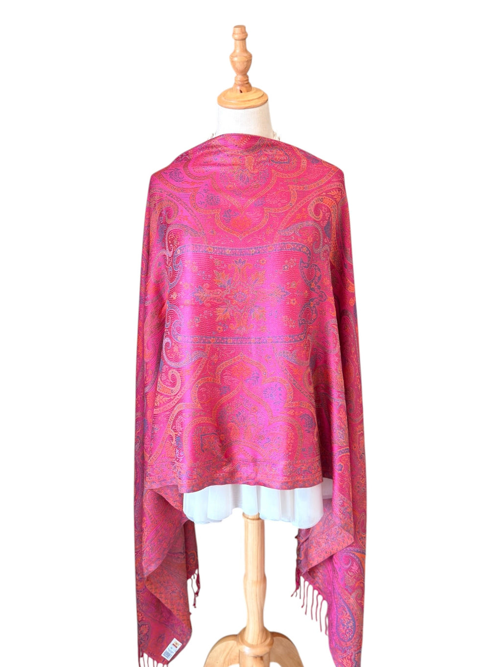 Noori Couture handwoven violet pink mulberry silk shawl with intricate paisley patterns on a dressmaker mannequin.