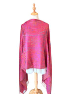 Noori Couture handwoven violet pink mulberry silk shawl with intricate paisley patterns on a dressmaker mannequin.